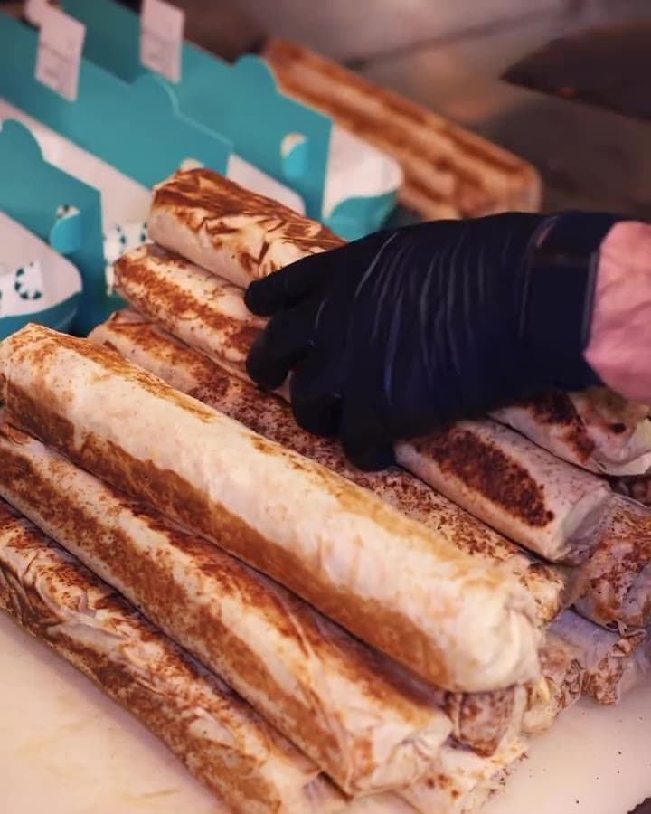 A mountain of sandwiches for a catering order.