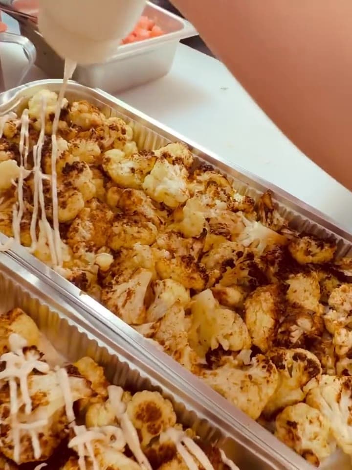 Tahini, poured over spiced roasted cauliflower.